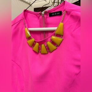 Pink shirt with yellow necklace